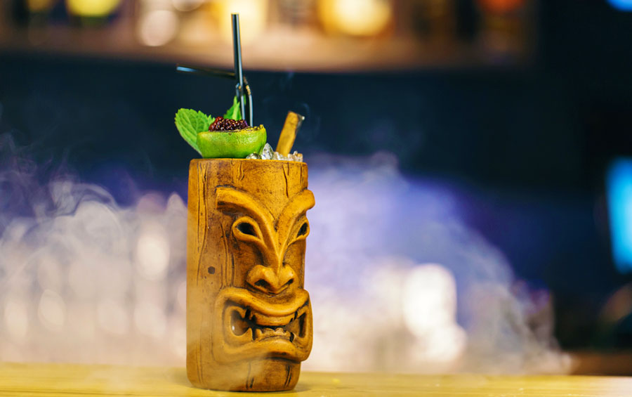 View of tiki drink cocktail placed on the bar counter