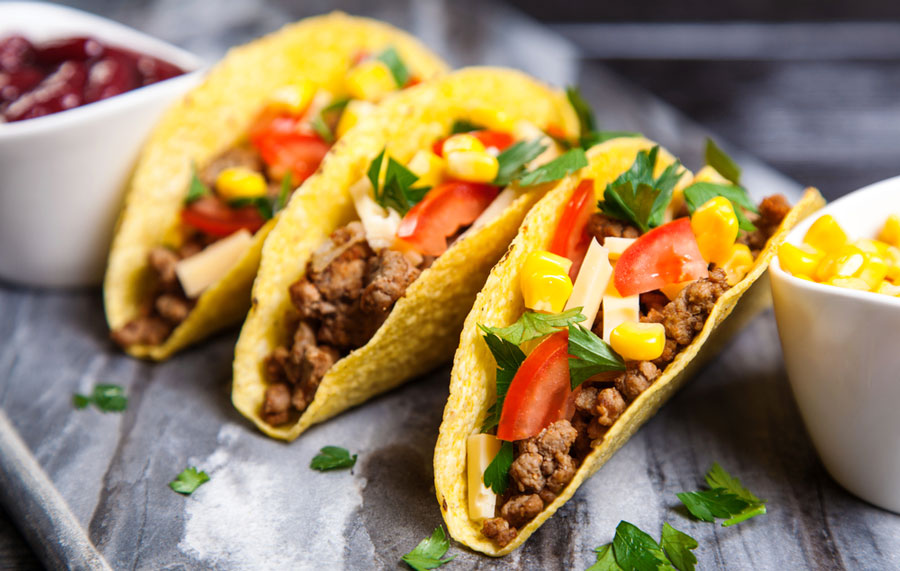 View of tacos filled with beef and vegetable