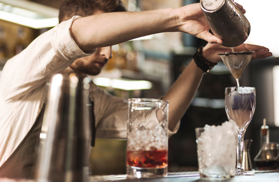 A bartender preparing a drink