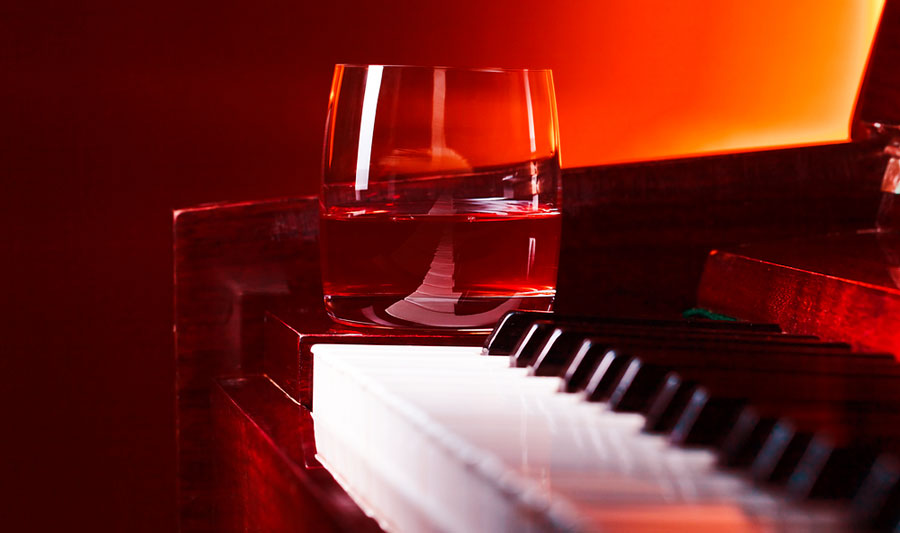 View of a alcoholic drink on a piano