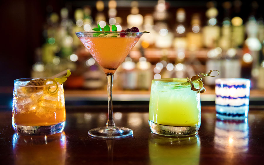 View of three different cocktails in a bar