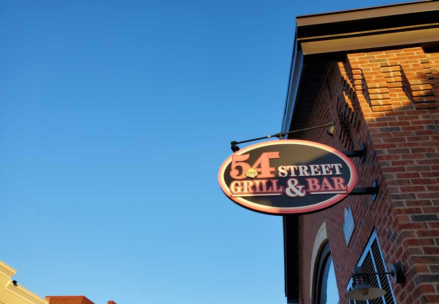 The 54th Street Grill & Bar signage on the entrance