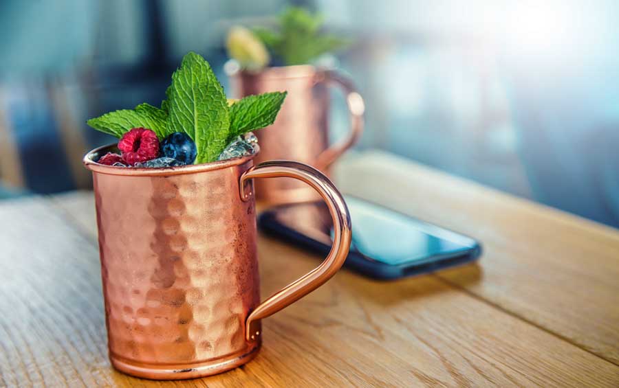 A glass of Moscow Mule on a table