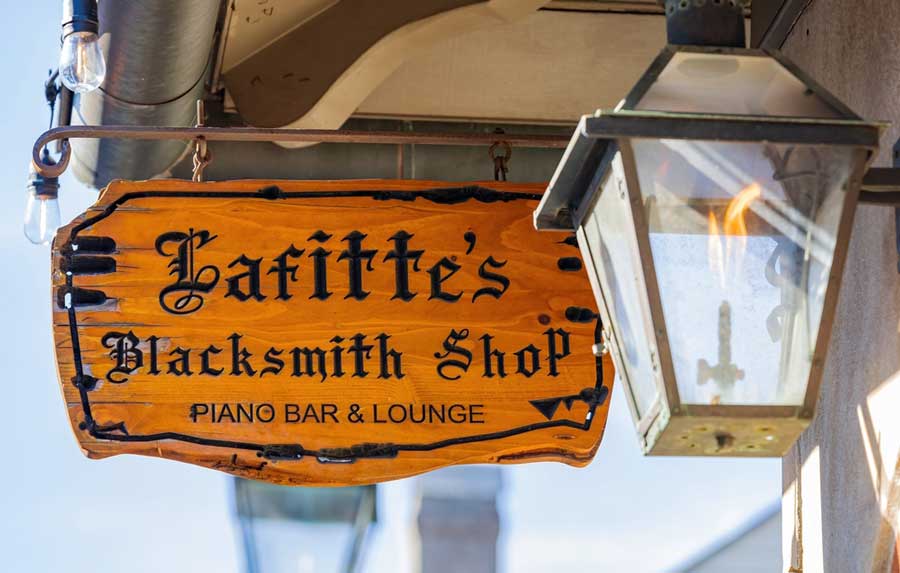 View of the Lafitte's Blacksmith Shop Bar signage on the entrance