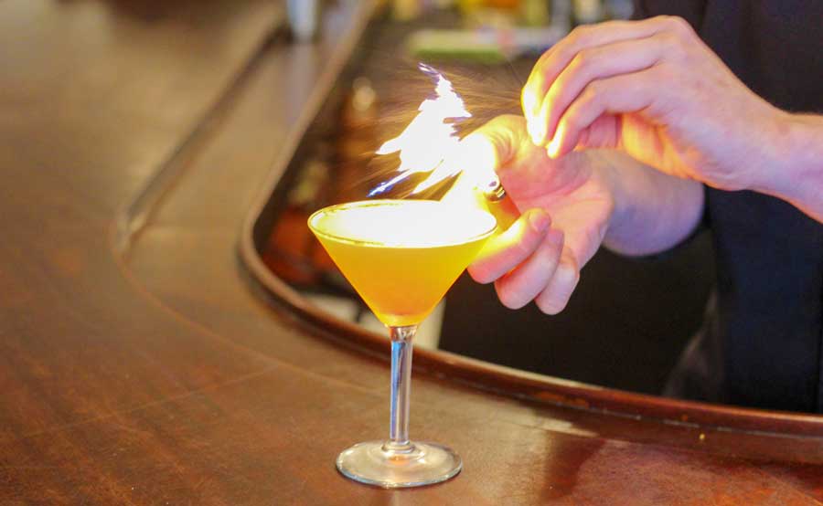 View of a cocktail with flame on it