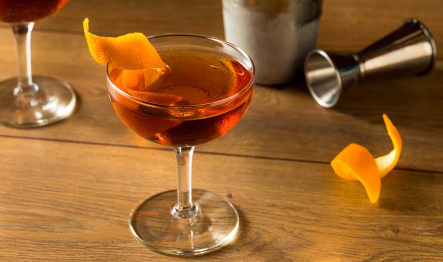View a cocktail with orange peel on it